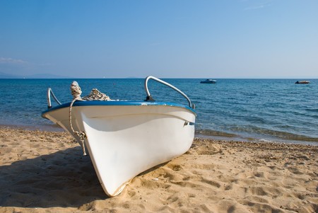 Plastic boat on beachの写真素材