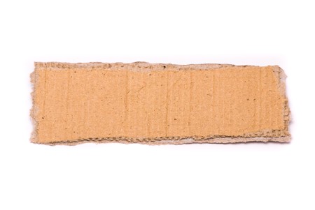 Ripped piece of cardboard on white backgroundの写真素材