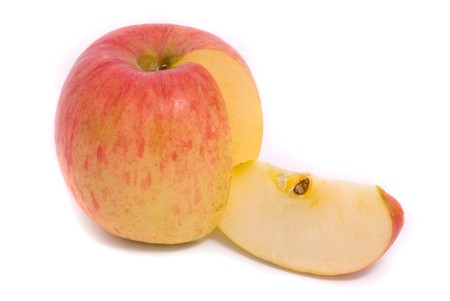Sliced yellow ripe apple isolated on white backgroundの写真素材