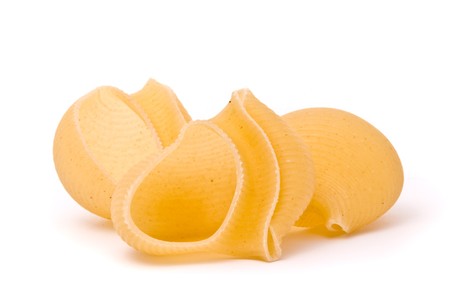 Raw italian pasta isolated on a studio white backgroundの写真素材
