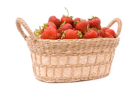 Strawberries in wooden basket isolated on whiteの写真素材
