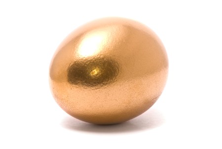 Golden eggs on studio white backgroundの写真素材