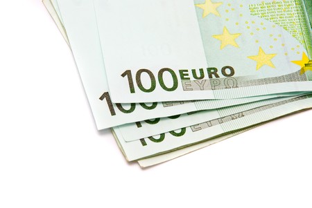 Hundred Euro banknotes on a white backgroundの写真素材