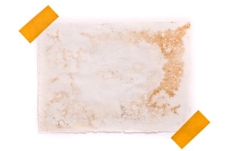 Isolated grungy taped up paperの写真素材