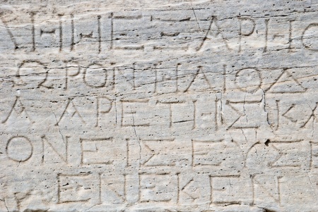 Stone background with antique Greek inscriptions の写真素材