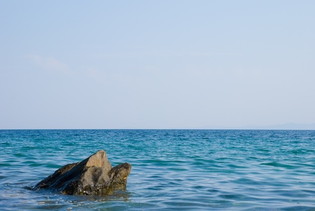 Coast of sea with stones in waterの写真素材