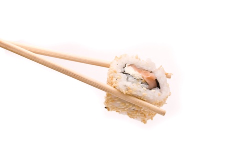 Sushi with chopsticks isolated on a white background の写真素材