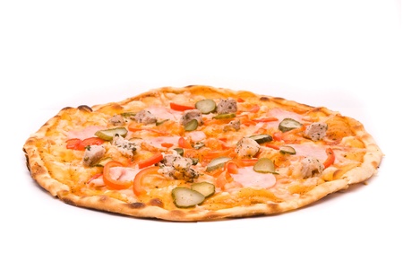 Pizza with sauce, cheese, marinated pork, ham, peppers, gherkins. の写真素材