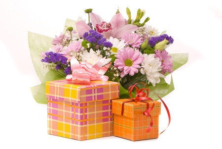 Magnificent bouquet and present boxes on a white の写真素材