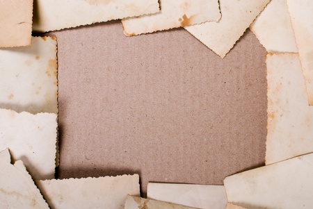 Vintage photos on cardboard background.の写真素材