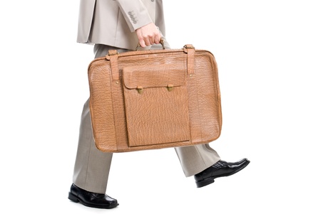 Walking man holding an old suitcase isolated over white background