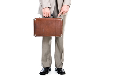 Man holding an old suitcase isolated over white backgroundの写真素材