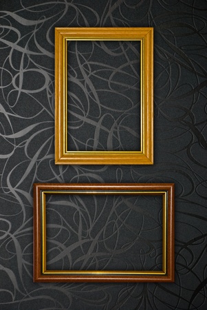 Gold frame on black vintage wallpaper backgroundの写真素材