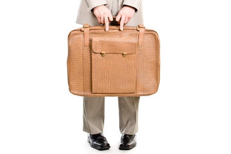 Man holding an old suitcase isolated over white backgroundの写真素材