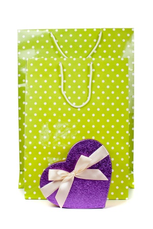 Green paper shopping bags and heart box isolated on white backgroundの写真素材