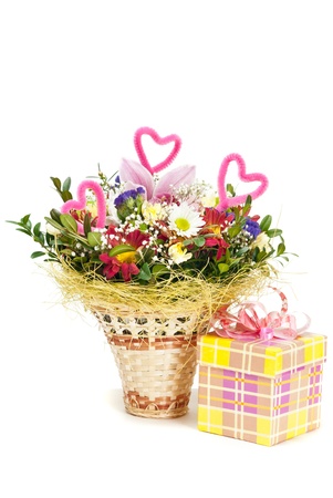 Beautiful bouquet in the basket and present box on a white backgroundの写真素材