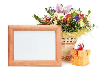 Gift box and wooden picture frame with flowers on white background の写真素材