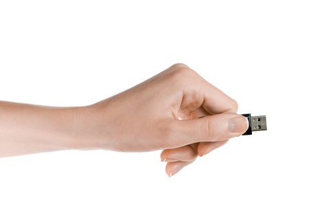 Flash drive in woman hand isolated on white background の写真素材