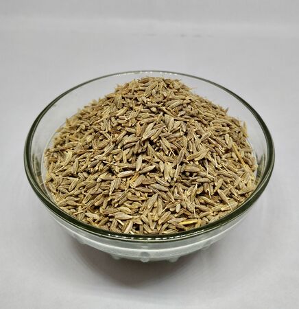 Common Cumin Or Zeeara In A Glass Bowl On White background Stock Photo.this photo is taken by vishal...