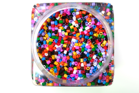 bank filled with colorful pony balls on a white background.の写真素材