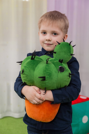 Boy with cactusの写真素材