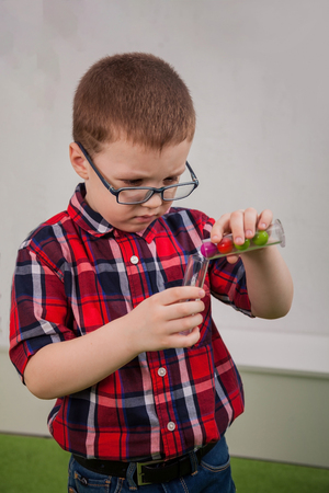 Boy with glasses as a scientistの写真素材