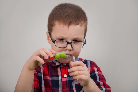 Boy with glasses as a scientist