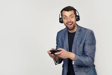 A gay male gamer playing a video game annoyed and upset screams with anger