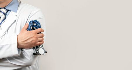 Male doctor pediatrician holding a rappaport stethoscope in his handの写真素材