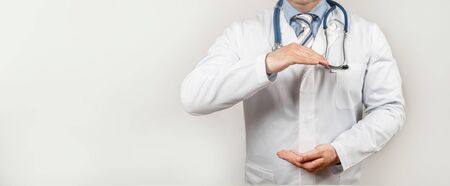 Doctor with two hands gesture health and life insurance for the whole conceptの写真素材