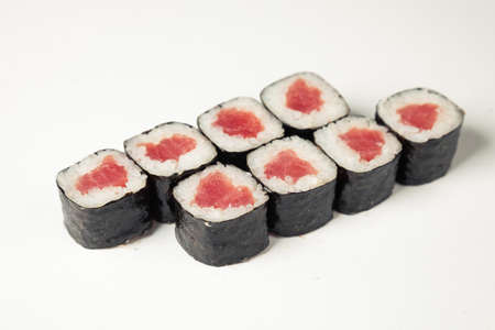 Sushi roll with tuna on a white plate, classic Japanese sushi. Traditional Japanese food with maki Delicious pieces of sushi For the restaurant menu. copyspace.の写真素材