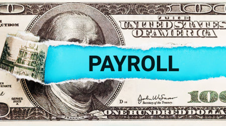 Payroll word written on with American Dollar-bills. Salary and wages concept. The word payroll on dollar usa background. Finance and money concept.の写真素材