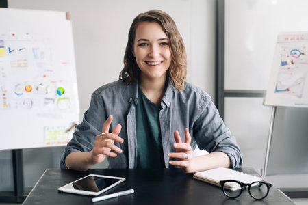 Professional and Engaging: Beautiful Business Woman Conducting a Video Conference, Communicating and Connecting with Confidence Through Web Camera, Whether in the Office or from the Comfort of Home.の写真素材