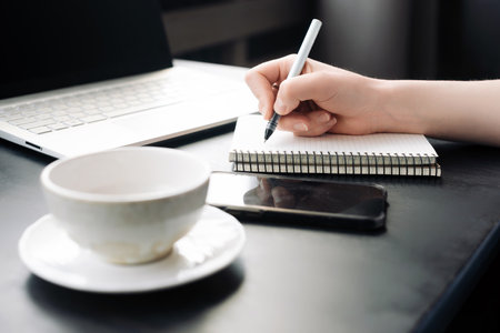 Focused Professional. Businessman at Work in Office, Planning Business Strategy. Journalism in Action: Journalist Engaged in Office Workspaceの写真素材