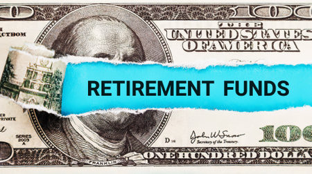 Retirement Funds. The word Retirement Funds in the background of the US dollar. Pension, Savings, and Retirement Planning Conceptの写真素材