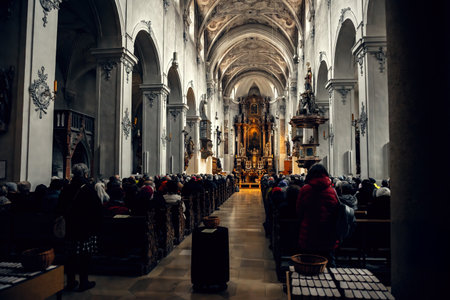 A grand historical church filled with worshipers. The intricate ceiling and detailed architecture...