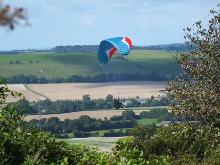 paraglider flying over the south downs