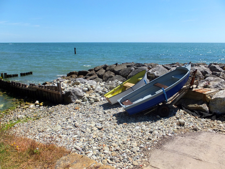 Yellow and Blue Boats on the Beachの写真素材