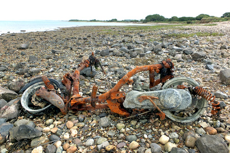 Rusty Motorcycle on a Beachの写真素材