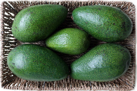 Overhead Shot of Five Avocados in a Basketの写真素材