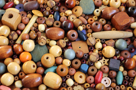A pile of different wooden beads for making jewellery itemsの写真素材