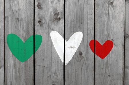 Three hearts of representing the colors of the Italian flag, green, white and redの写真素材