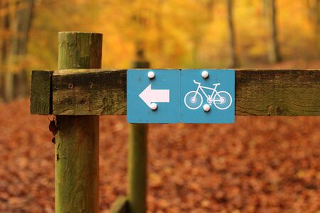 Off Road Bike Track. A cycle path sign in an autumnal rural woodland settingの写真素材
