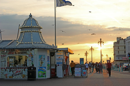 Brighton, East Sussex, England. 10th September 2019. Warm glow and chilled vibes as the sun sets near Brighton Palace Pier.のeditorial素材