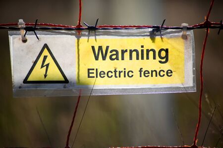 An electric fence warning signの写真素材