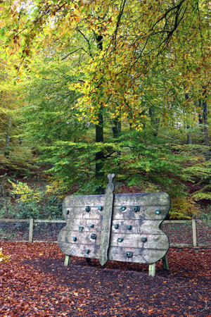 Horndean, Hampshire, England. 5th November 2019. A small climbing wall in an enclosed playground at Queen Elizabeth Country Park.のeditorial素材