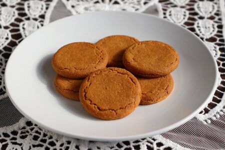Ginger snaps. A plate of ginger biscuits.