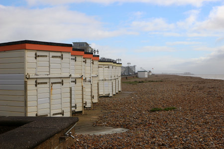 Worthing, West Sussex, England. 11th March 2020. A row of beach huts on Worthing beach.のeditorial素材