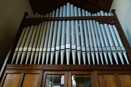Close up of a pipe organ inside a church