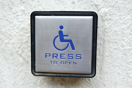 Disabled sign on the wall of a building, close-upの写真素材
